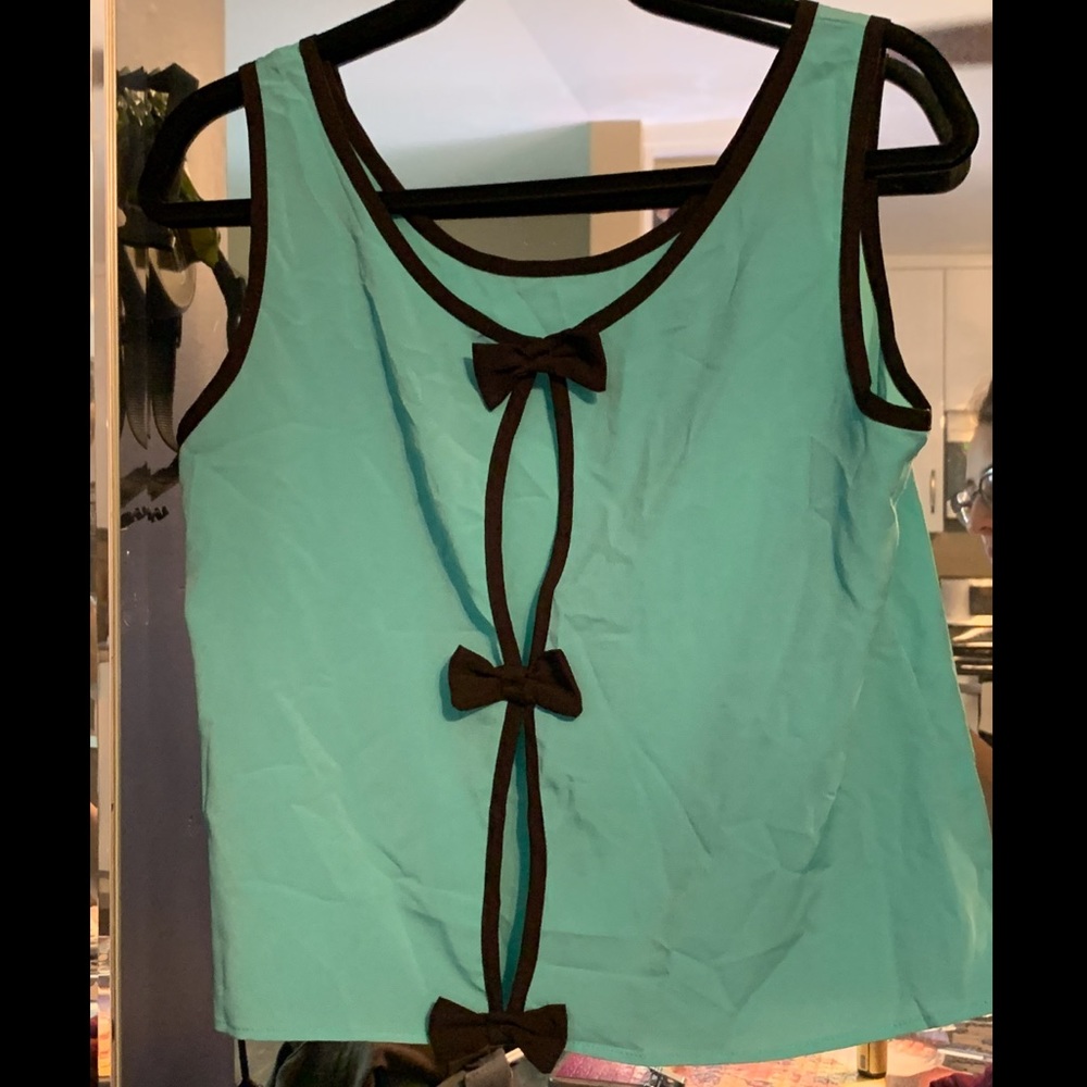 Turquoise blouse with bows